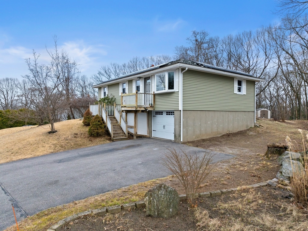 38 Orton Street Worcester, MA 01604 - Photo 27 of 37 a view of a house with a yard covered with snow in the yard