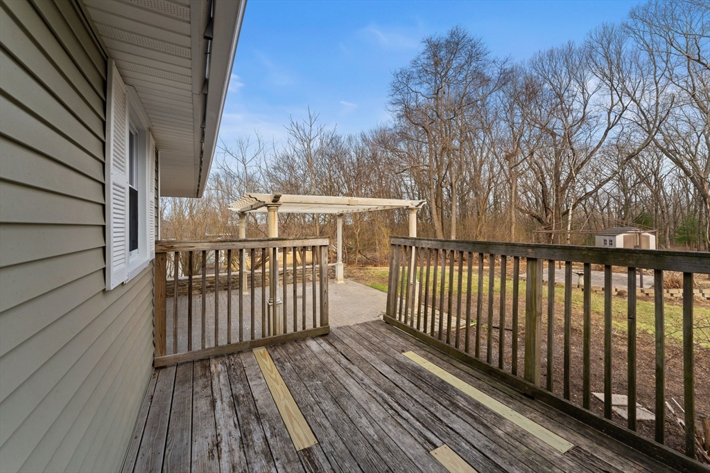 38 Orton Street Worcester, MA 01604 - Photo 34 of 37 a balcony with wooden floor and fence