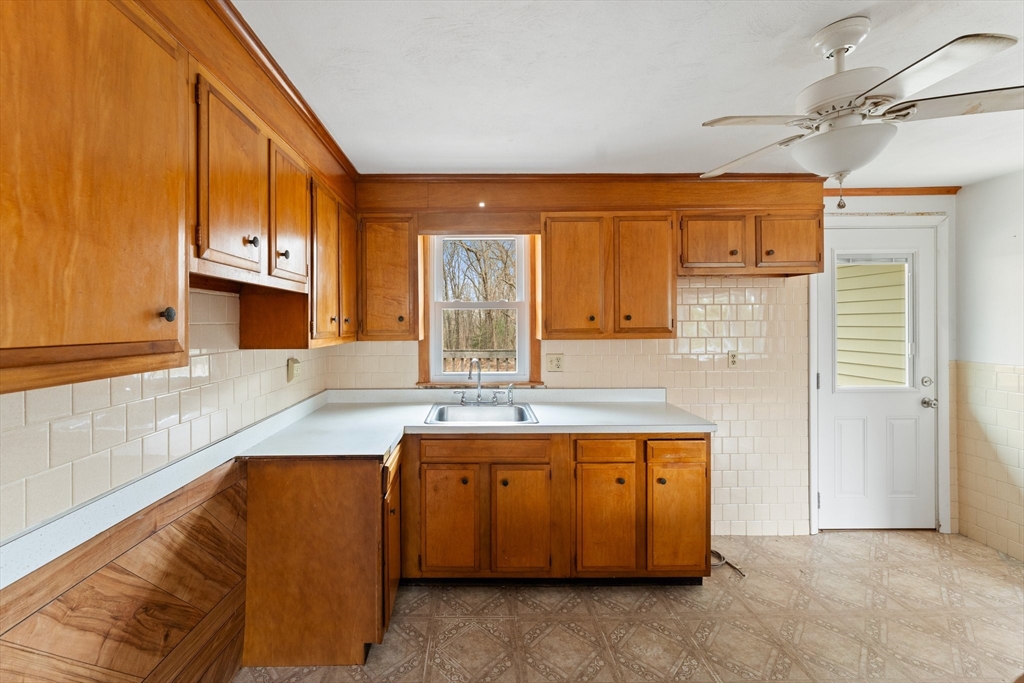 38 Orton Street Worcester, MA 01604 - Photo 9 of 37 a kitchen with a sink a counter top space and cabinets