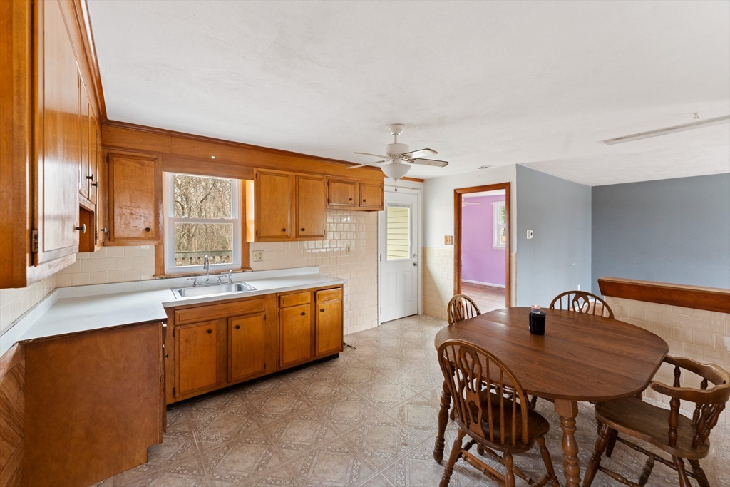 38 Orton Street Worcester, MA 01604 - Photo 10 of 37 a large kitchen with a table and chairs in it