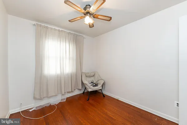 a bed room with a bed and a window