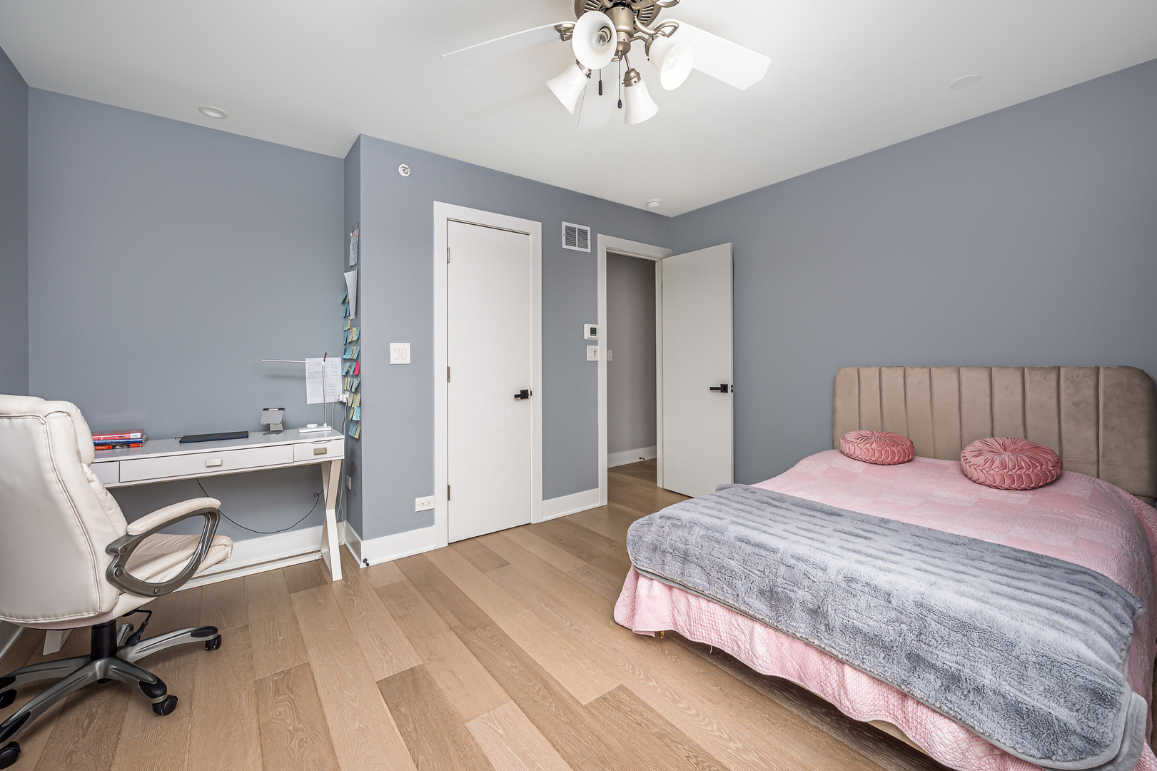 101 North Schoenbeck Road Prospect Heights, IL 60070 - Photo 13 of 30 a bedroom with a bed and chandelier