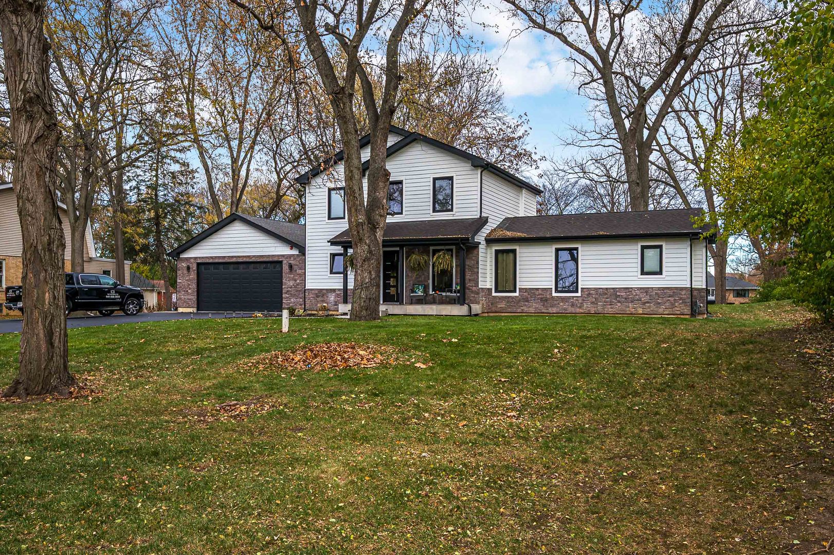 101 North Schoenbeck Road Prospect Heights, IL 60070 - Photo 29 of 30 a front view of a house with a garden and trees