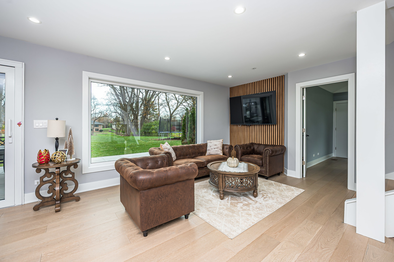 101 North Schoenbeck Road Prospect Heights, IL 60070 - Photo 6 of 30 a living room with furniture and a large window