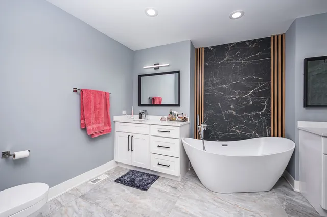 a bathroom with a sink a bathtub and a toilet