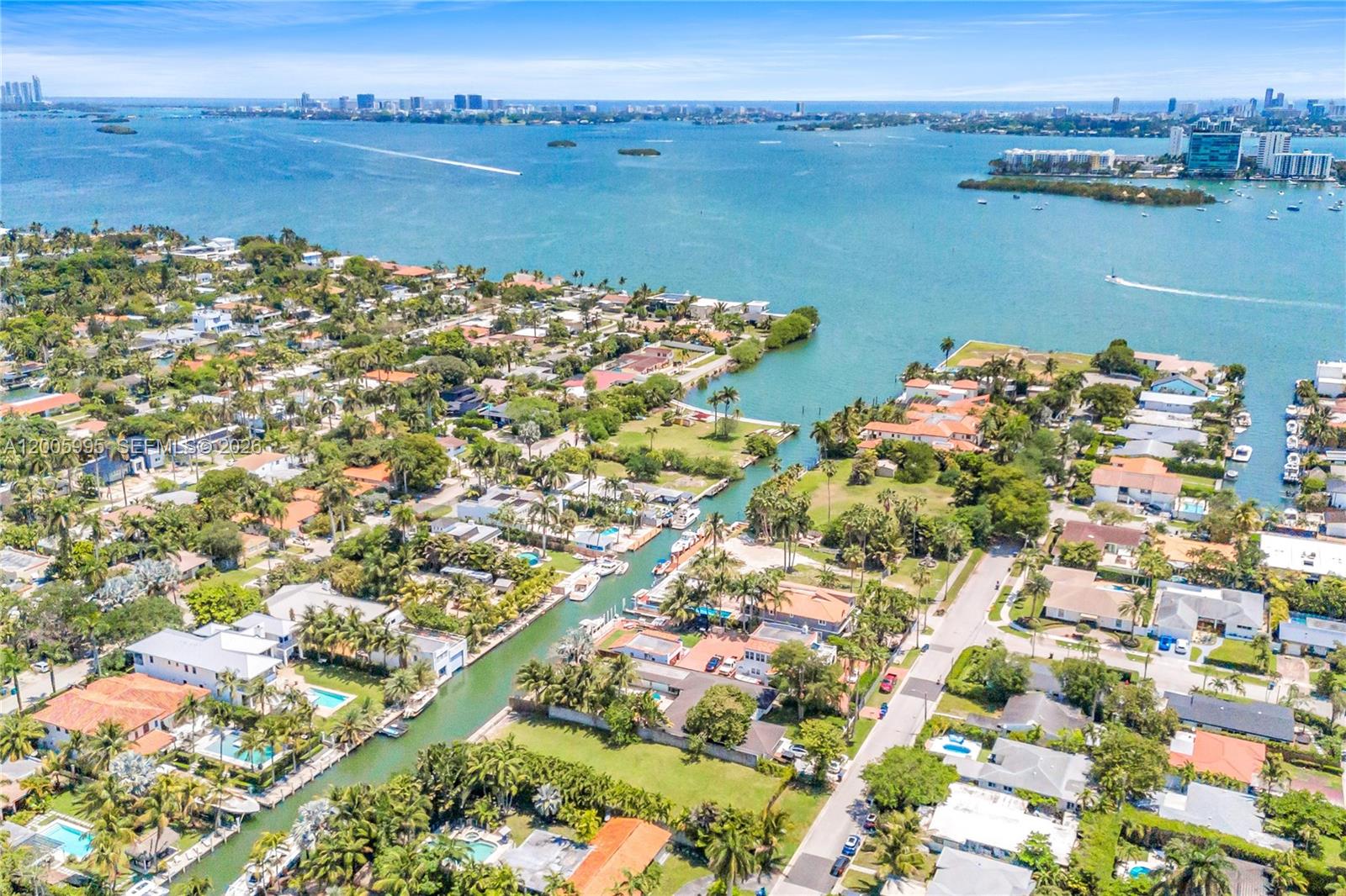 1051 Northeast 83rd Street Miami, FL 33138 - Photo 5 of 11 a view of a lake with a city