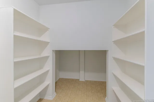 a view of an empty walk in closet