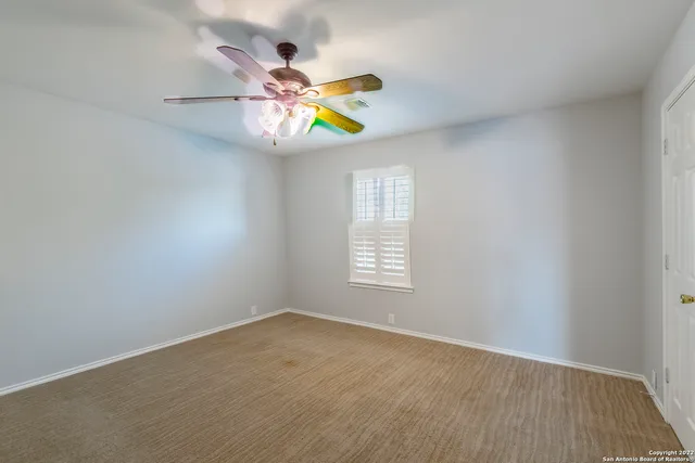 a view of an empty room and window