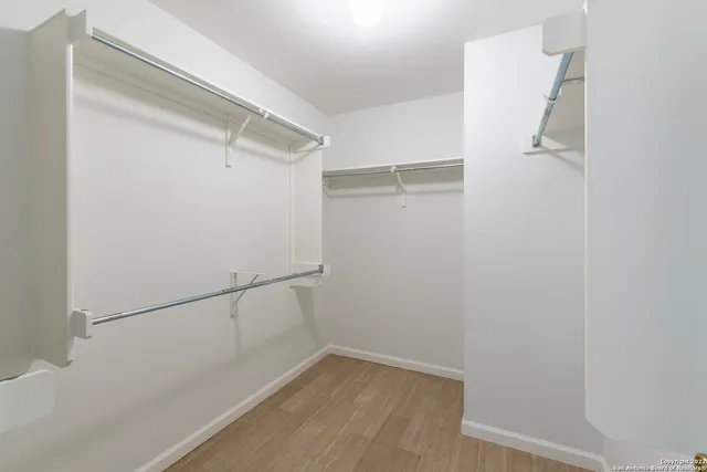 a view of an empty walk in closet
