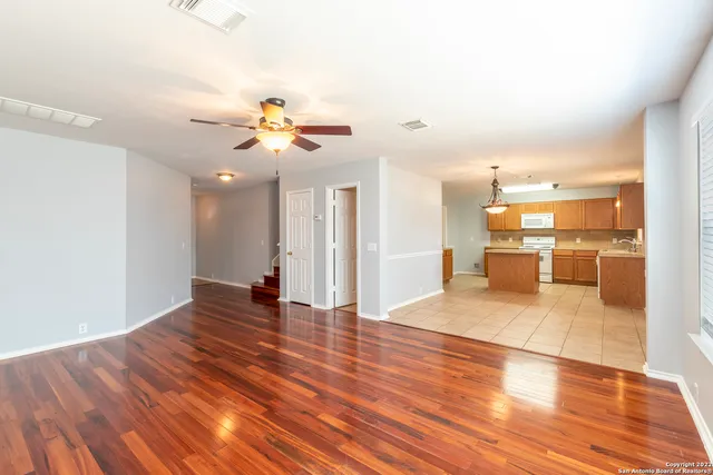 a view of a living room with wooden floor
