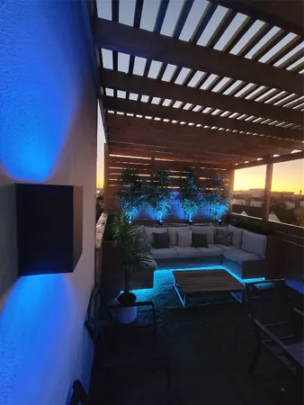 a room with furniture and a potted plant