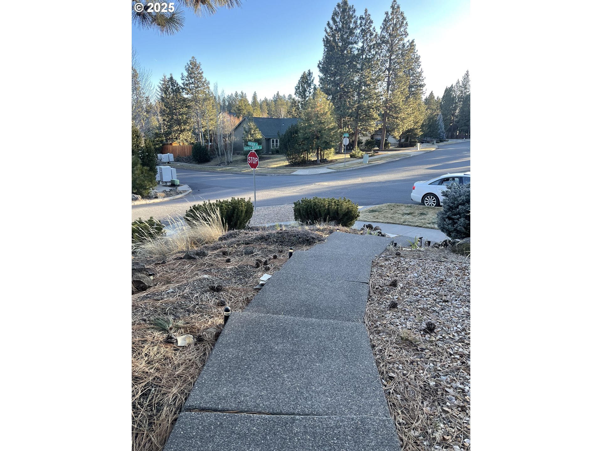 61257 Bronze Meadow Lane Bend, OR 97702 - Photo 2 of 16 a view of a yard in front of a house