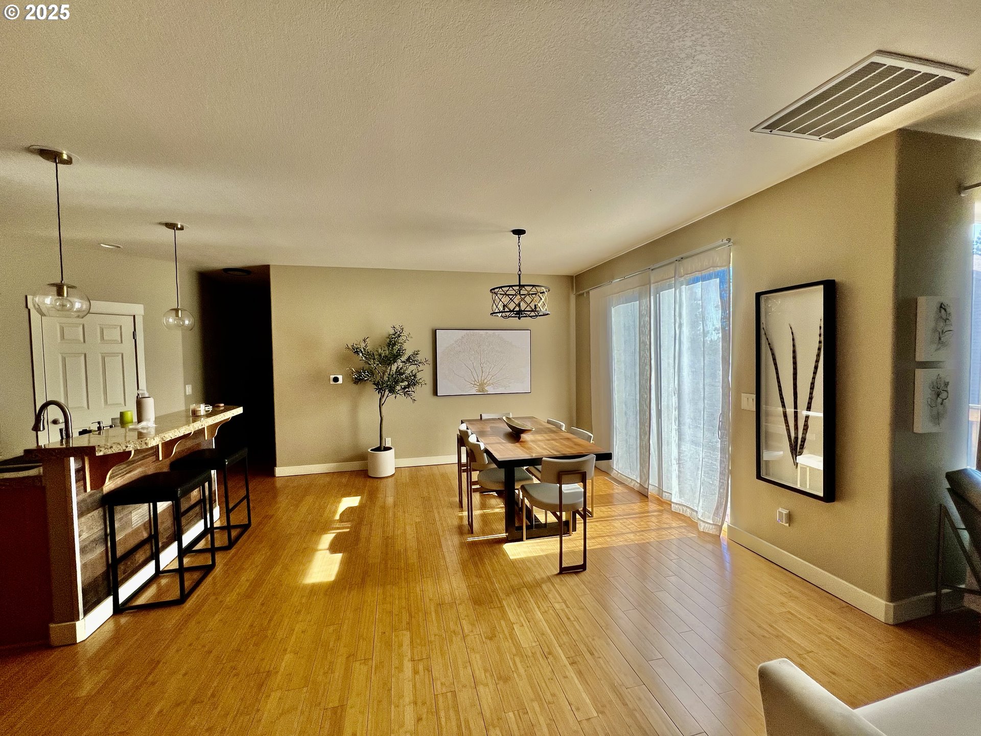 61257 Bronze Meadow Lane Bend, OR 97702 - Photo 7 of 16 a living room with furniture and wooden floor