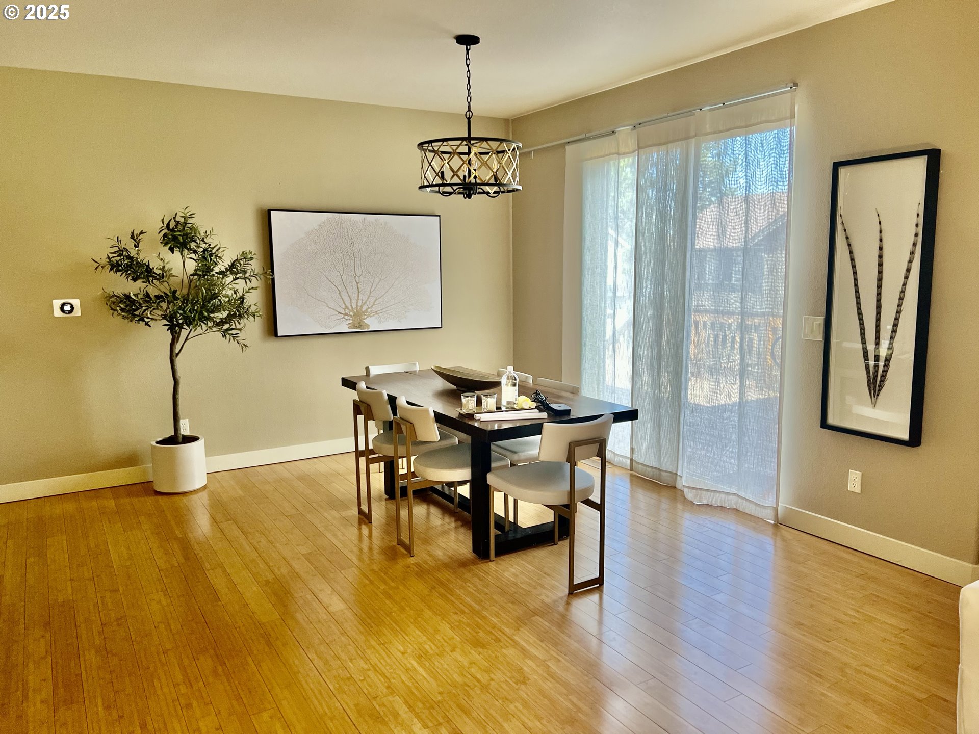 61257 Bronze Meadow Lane Bend, OR 97702 - Photo 8 of 16 a view of a dining room with furniture and wooden floor