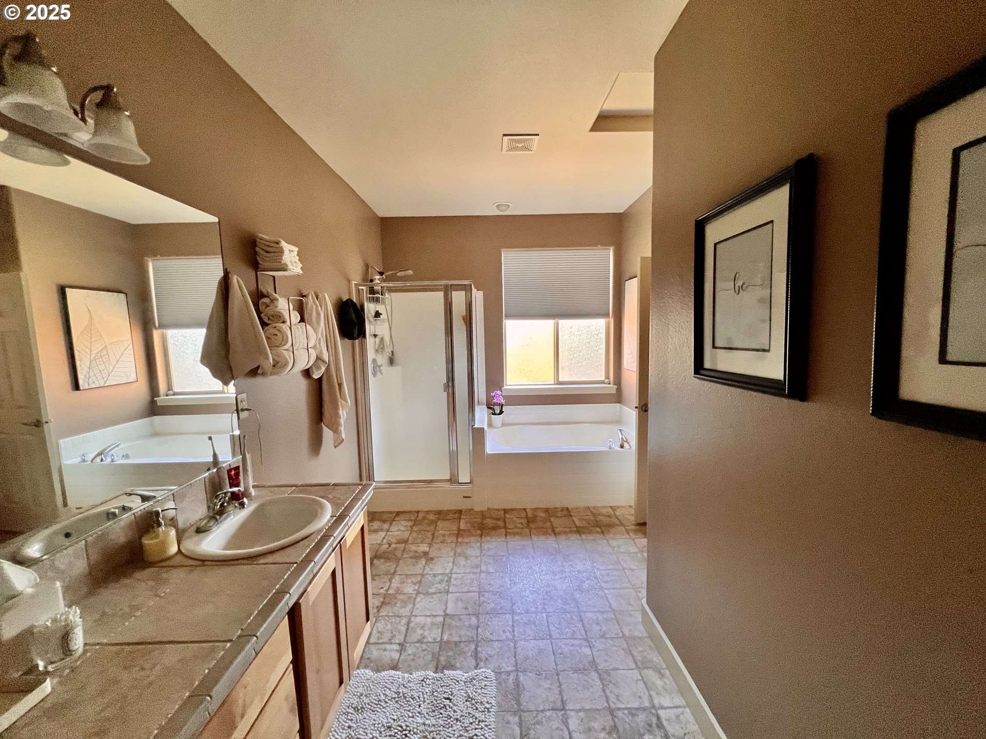 61257 Bronze Meadow Lane Bend, OR 97702 - Photo 10 of 16 a bathroom with double vanity and a mirror