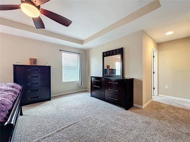 a view of walk in closet with clothes