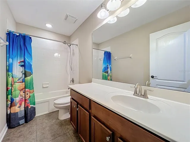 a view of a hallway with storage and utility