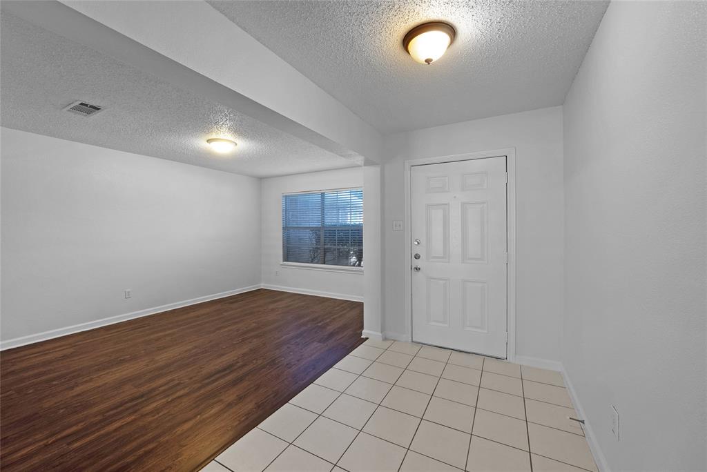 2910 Chisholm Trail Corinth, TX 76210 - Photo 2 of 30 a view of an empty room and window