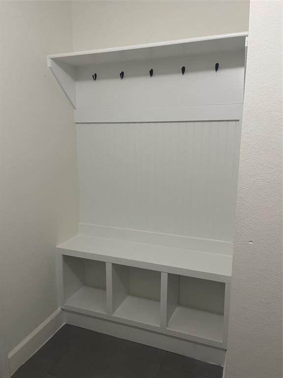 617 Barbara Way Bastrop, TX 78602 - Photo 14 of 20 A built-in bench and coat rack offer practical entry storage.