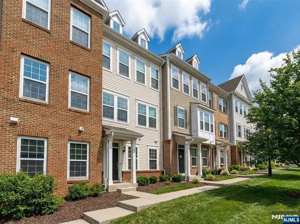 front view of building with a yard