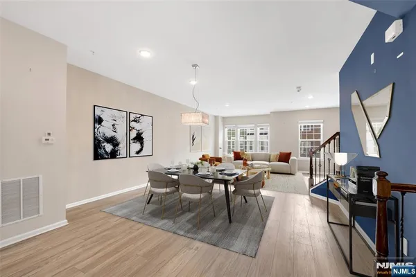 a living room with fireplace furniture and a wooden floor
