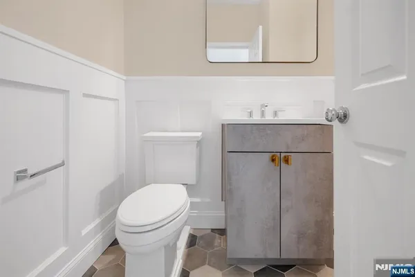 a bathroom with a toilet and a sink
