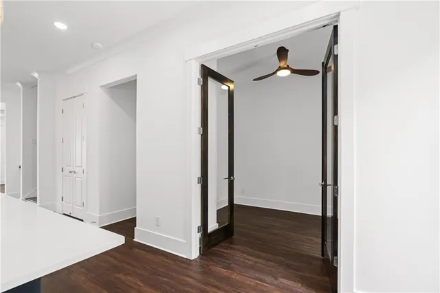 a bathroom with a double vanity sink a mirror and a bathtub