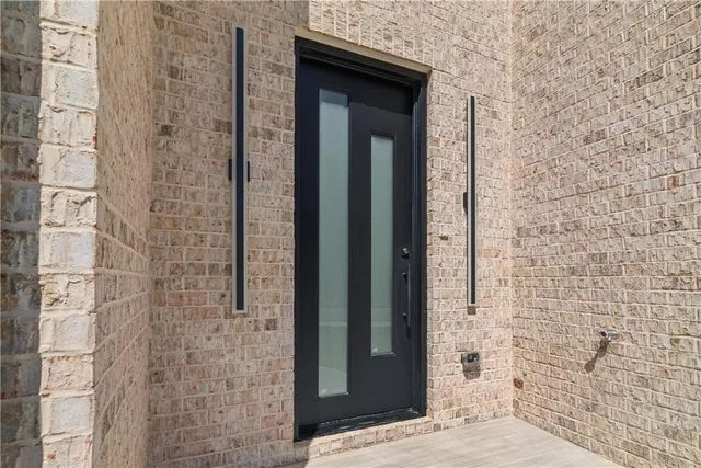 a bathroom with a shower and a sink