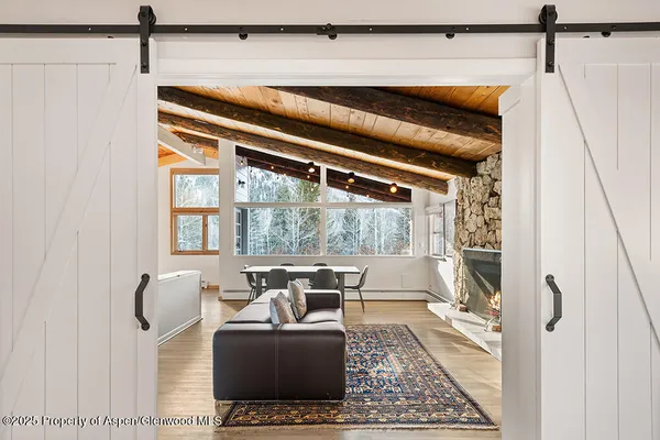 a living room with furniture and a window