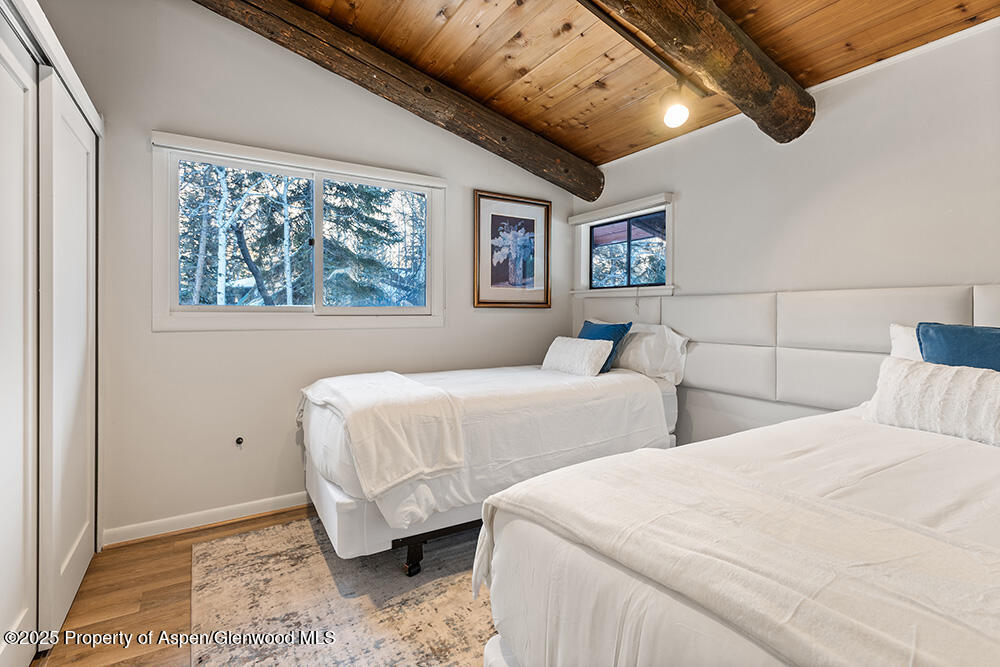 1215 Riverside Drive Aspen, CO 81611 - Photo 17 of 20 a bedroom with double bed and a window