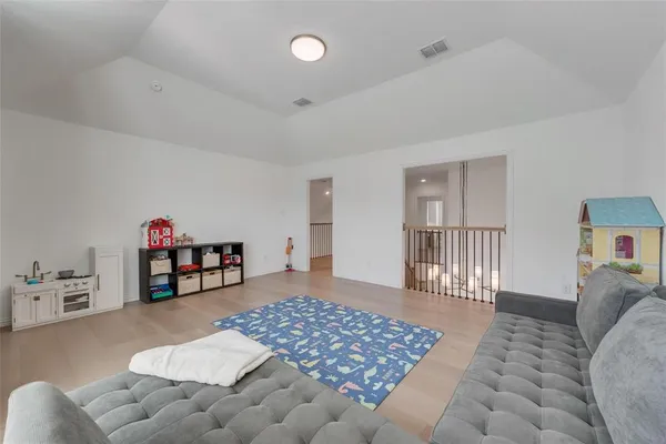 a bedroom with furniture and a rug