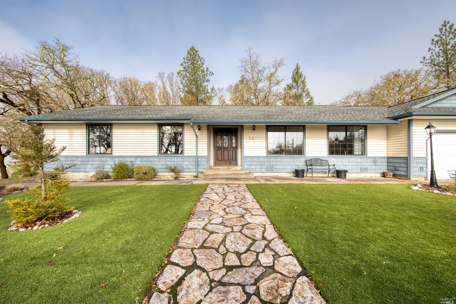 3440 Ridgewood Road Willits, CA 95490 - Photo 1 of 1 a front view of a house with garden