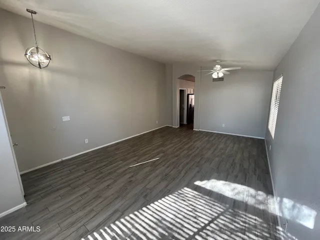 a view of a livingroom with wooden floor