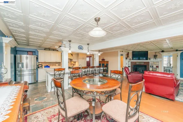 a view of a hallway with wooden floor and a potted plant