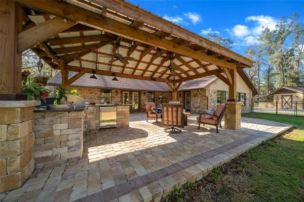 a kitchen with stainless steel appliances granite countertop a stove and a large counter space