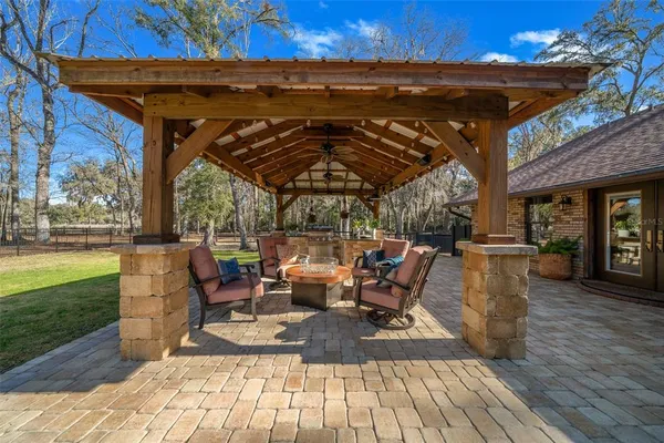 a kitchen with stainless steel appliances granite countertop a sink and a refrigerator