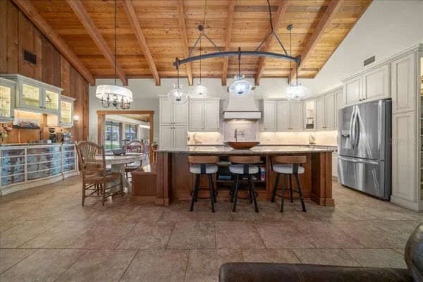 a spacious bathroom with a granite countertop sink and a mirror