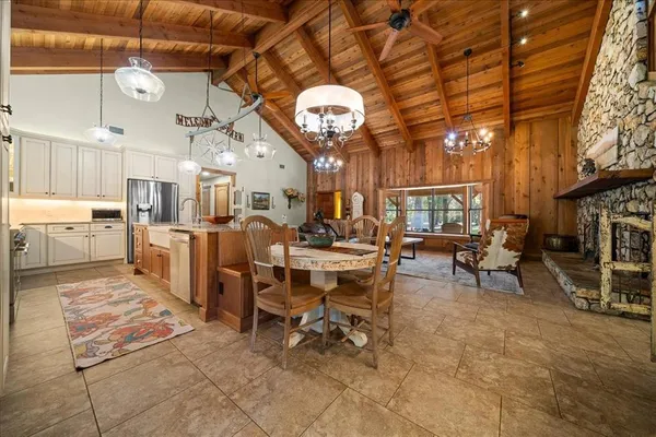 a view of a yard with wooden fence