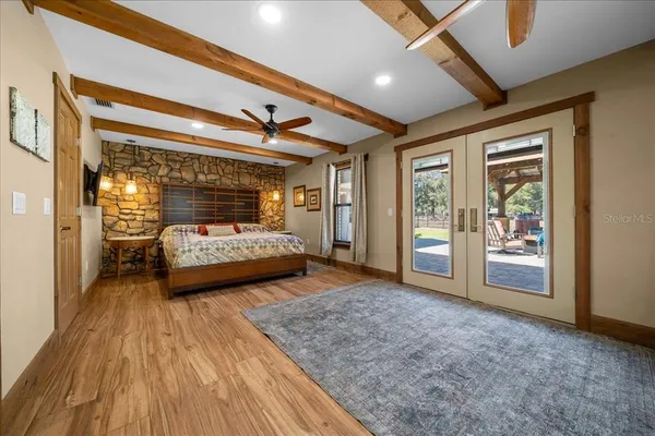 a view of a house with backyard porch and sitting area
