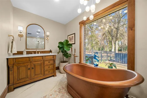 a view of a house with a fence and a yard