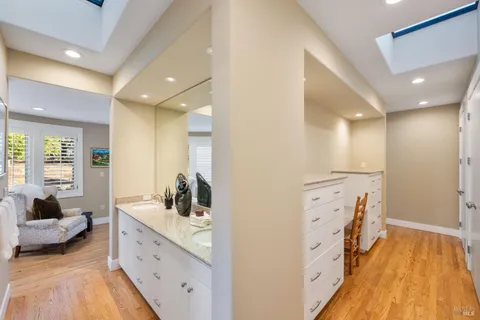 a spacious bathroom with a double vanity sink and a mirror