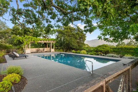 a view of swimming pool with a patio