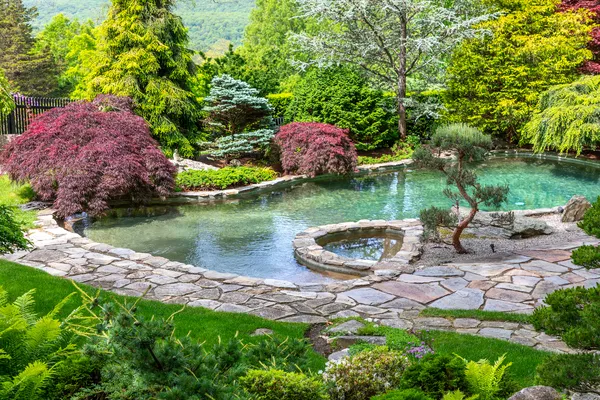 a view of a lake with a house in the background