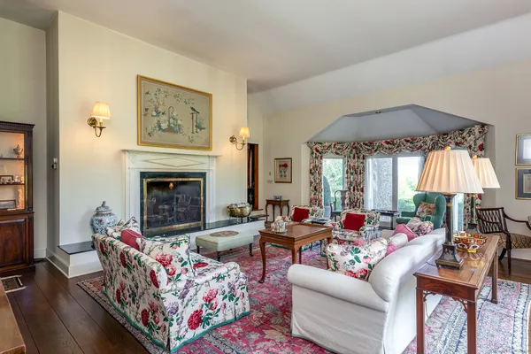 a living room with furniture and a fireplace