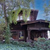 a view of house with outdoor space and trees