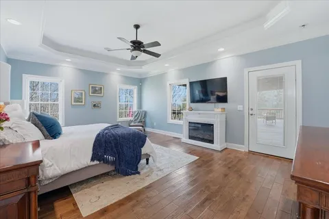 a spacious bathroom with a double vanity sink a mirror and a shower