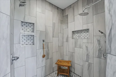 a bathroom with a toilet sink vanity and mirror