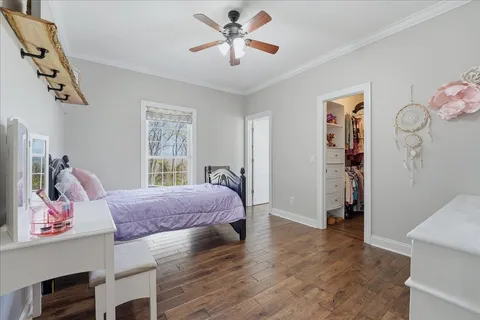 a bed room with a bed and a television