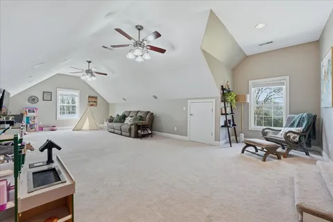 a view of a swimming pool with a patio and a yard