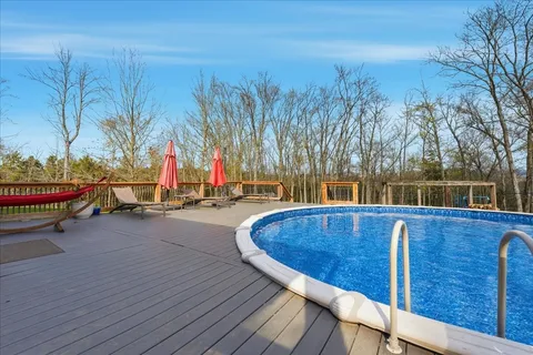 a view of a backyard with table and chairs